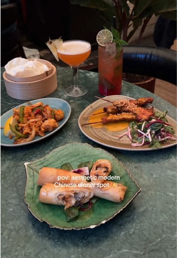 A short, aesthetic montage showcasing the interior and various dishes at Mama Yo, a Chinese restaurant. The video features slow pans of the dining area and close-ups of the food, including squid, beef, prawns, and dessert.