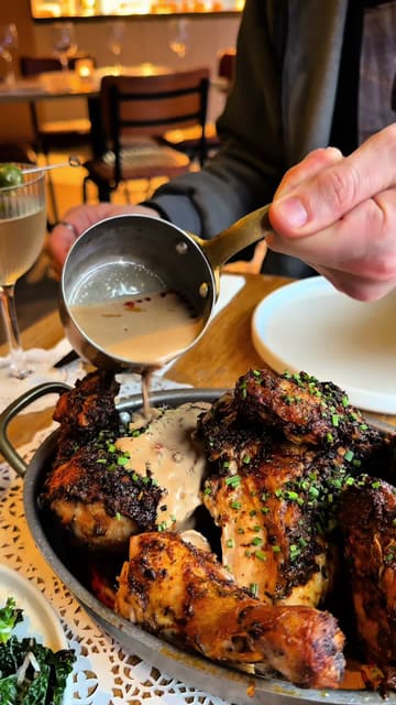 A short, engaging video showcasing a new chicken shop called Le Coq Boutique in Manchester's Northern Quarter, highlighting their roasted chicken, sides, and unique chicken-fat martini.