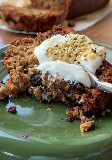 A recipe tutorial for salted peanut banana bread, featuring the creator demonstrating the steps from mashing bananas to baking and slicing the final product.