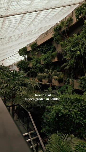 A montage of clips showcasing the Barbican Conservatory in London, highlighting its tropical plants, indoor pond, and brutalist architecture.