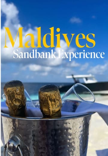 A montage of scenic beach shots at a luxury resort, featuring a sandbank, a boat, and a bento box meal served on the beach.