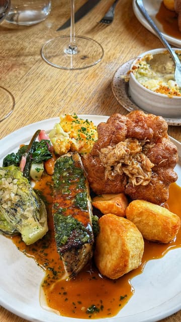 A couple visits Roots York to review their new Summer Sunday Feast menu, showcasing a variety of starters, a main roast course, and dessert.