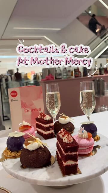 A mother-daughter outing featuring an afternoon tea experience at Mother Mercy, located within a department store. The video highlights the bottomless cocktail offering served in teapots and a selection of cakes, including red velvet, choux buns, and blueberry cheesecake.