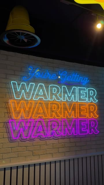 A promotional reel covering the grand opening of an Insomnia Cookies branch in Newcastle, showcasing the late-night opening hours, the interior, and various activities like magic tricks and a prize wheel.