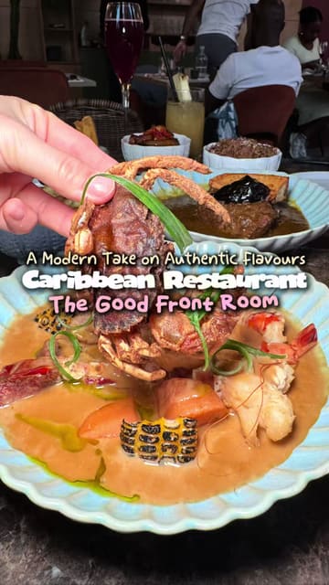 A high-quality food showcase of The Good Front Room, a Caribbean restaurant in London, featuring close-up shots of various dishes like curry goat, seafood boil, and jerk chicken.