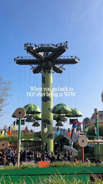 A short, handheld POV video of a person riding a roller coaster at a Disney theme park, comparing it to another location.