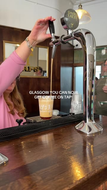 A short video showcasing a coffee shop in Glasgow that serves coffee on tap, demonstrating the pouring and topping process.