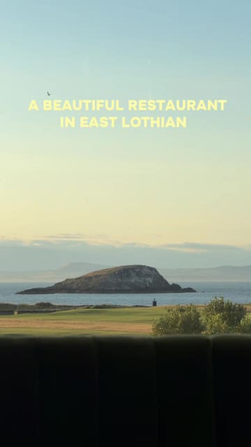 A review of The Lawn at the Marine Hotel in North Berwick, East Lothian. The video features a voiceover narration guiding the viewer through the menu, including starters like scallops and beetroot salad, mains like lamb and ox cheeks, and desserts like cheesecake, all while highlighting the scenic coastal views from the restaurant.