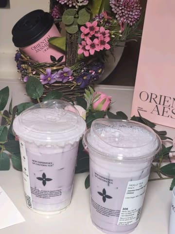 A promotional reel for Molly Tea highlighting their new Grape Series drinks and a Mother's Day special offer involving greeting cards and scented candles.