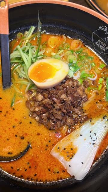 A vlog-style review of the newly opened Maki & Ramen restaurant at the Metrocentre. The video features shots of the restaurant's interior, a look at the menu, and close-ups of the sushi and ramen dishes ordered. The creator provides a positive review, highlighting the quality of the food and the quick service.