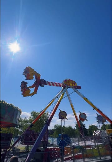 A creator visits the Xtreme Funfair at Rushmere Shopping Centre, providing a tour of the rides and games while sharing practical information like opening times and the token system.