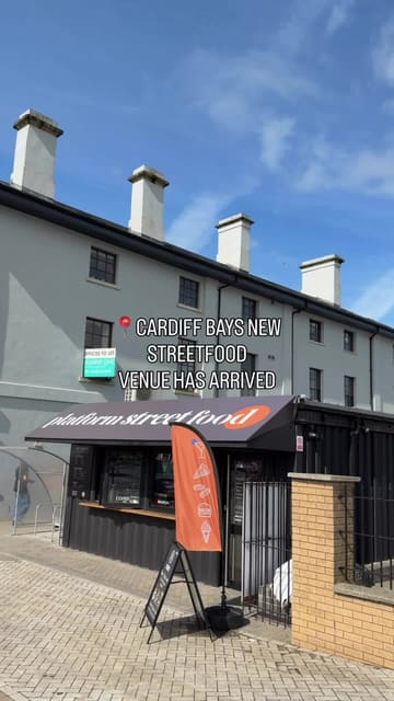 A promotional video for a new street food venue in Cardiff Bay, featuring a variety of vendors including burger, pasta, pizza, and dessert spots. The video highlights the food offerings with close-up shots and provides a glimpse of the venue's outdoor seating area.