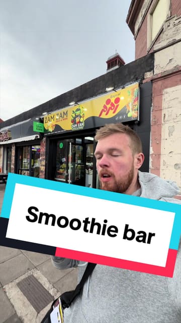 The creator visits Zam Zam Juice & More in Newcastle to review a variety of their offerings, including a carrot juice and ice cream drink, slushy noodles, a blue blast smoothie, and an acai bowl. He provides commentary on the taste and uniqueness of each item while also showing the menu.