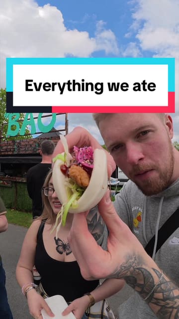 A couple visits a food festival in Newcastle, sampling a variety of street food items including prosecco, Portuguese tarts, Jamaican patties, banh mi, mini pancakes, chicken tacos, and bao buns.
