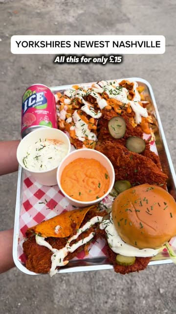 A creator reviews a £15 munch box from Bird Haus, located in a food court in Bradford, Yorkshire. The video features close-ups of a Nashville hot chicken burger, taco, tenders, and loaded fries with mac and cheese, with the creator providing commentary on the taste and texture.