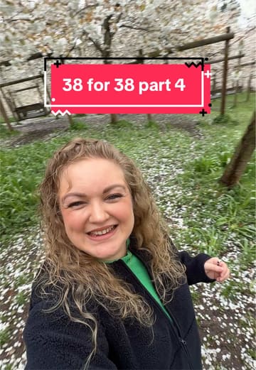 A personal vlog documenting a visit to Alnwick Garden during the cherry blossom season as part of a '38 for 38' series. The creator explores the cherry orchard, interacts with the garden's features like the swings and the 'duck hunt' display, and shares the experience with friends.