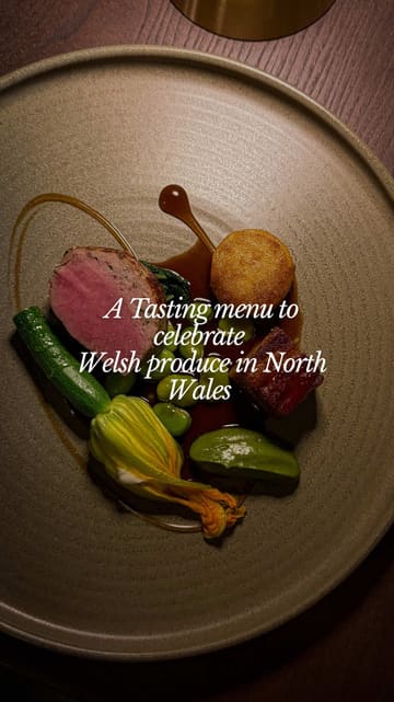 A couple visits the Penmaenuchaf Hotel in North Wales, showcasing the renovated interiors, the bar, and an eight-course tasting menu featuring local Welsh produce.