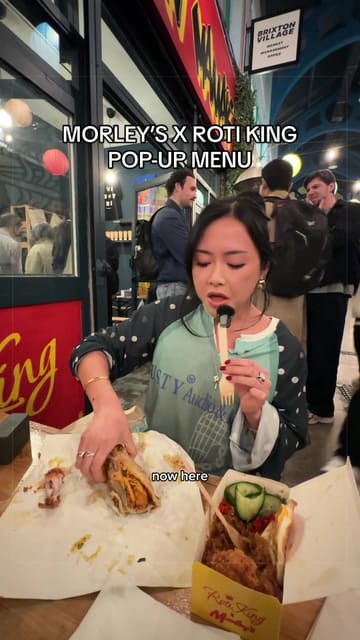 A creator reviews the Morley's x Roti King pop-up in Brixton Village, sampling the Sedap Wrap and fried chicken with nasi goreng. The video captures the casual atmosphere of the market and provides honest feedback on the flavours.