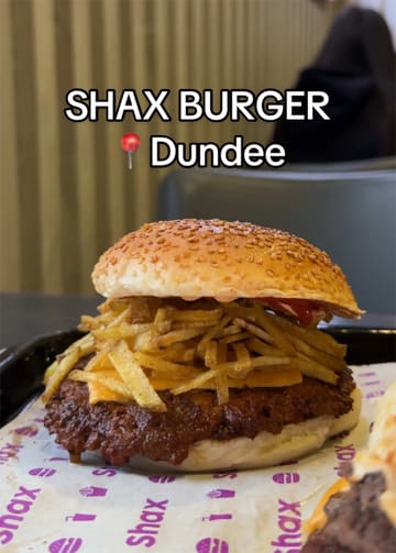 A food review video featuring a creator trying various burgers, wraps, loaded fries, and sides at Shax in Dundee.