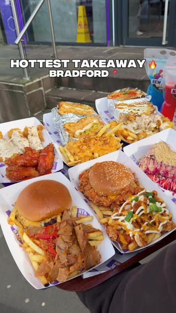 A creator showcases a large variety of takeaway food from NYK (New York Krispy) in Bradford, including burgers, loaded fries, wings, and desserts.