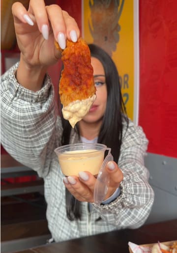 A fast-paced vlog-style reel showcasing a food tour around the Belfast Food Quarter, featuring visits to multiple eateries including Madame Pho, Bao Bun, Poke Shack, Kawa, and Al Gelato.