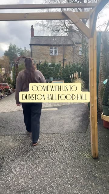 A short, montage-style video showcasing the interior and product range of Dunston Hall Food Hall, including the deli, butcher counter, and bakery section.