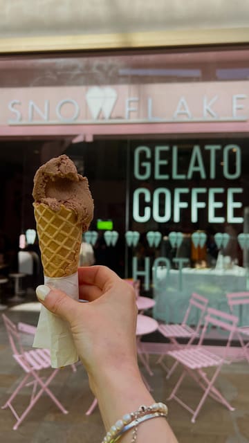 A vibrant vlog-style video featuring a visit to Snowflake Gelato in Oxford. The creator highlights the unique gelato flavours, including a sweet corn option, and participates in an interactive masterclass where they learn about gelato production and try their hand at scooping.
