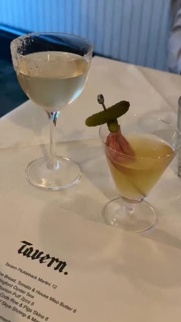 A short, fast-paced video showcasing a variety of dishes and drinks at Tavern, a candlelit restaurant. The video features close-up shots of the menu, cocktails, oysters, small plates, and main courses, providing a quick overview of the dining experience.