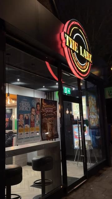 A review of The Ladz in Cardiff, featuring a variety of their menu items including smash burgers, peri chicken, loaded fries, lamb chops, and milkshakes.