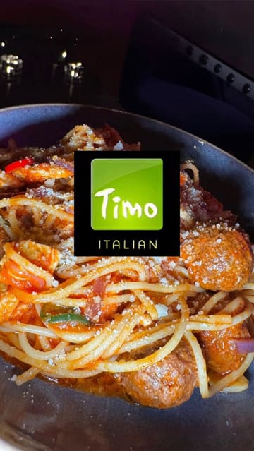 A montage video showcasing the interior, drinks, and various Italian dishes at Timo Restaurant, featuring a warm, intimate atmosphere suitable for dining.