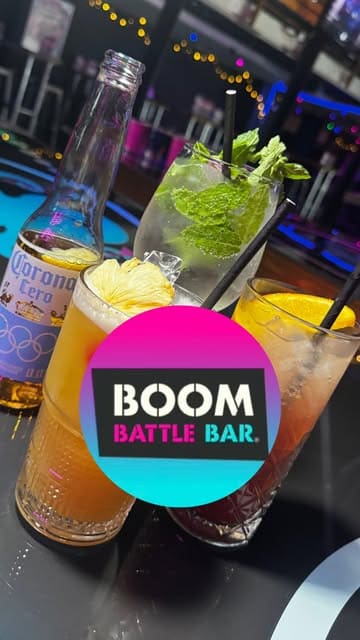 A fast-paced, energetic reel showcasing a visit to BOOM Battle Bar, featuring various competitive games like axe throwing and interactive darts, alongside food and drinks.