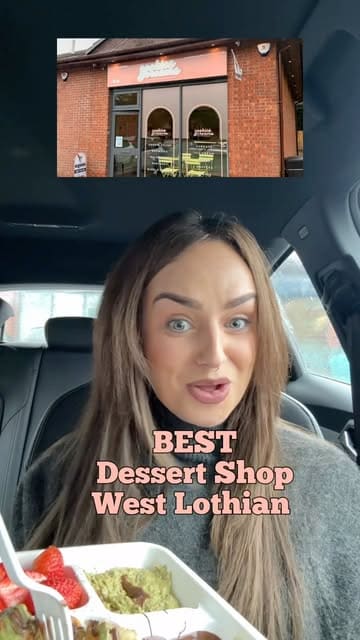 A creator reviews a dessert shop in Livingston, showcasing a convenient 'snack tray' designed for eating in the car, alongside other menu items like chocolate-covered strawberries, protein shakes, and various cakes.