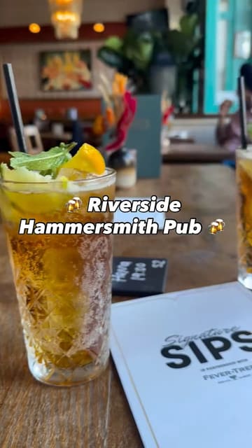 A short, energetic reel showcasing The Crabtree, a riverside pub in Hammersmith, highlighting its outdoor seating area and cocktail menu.