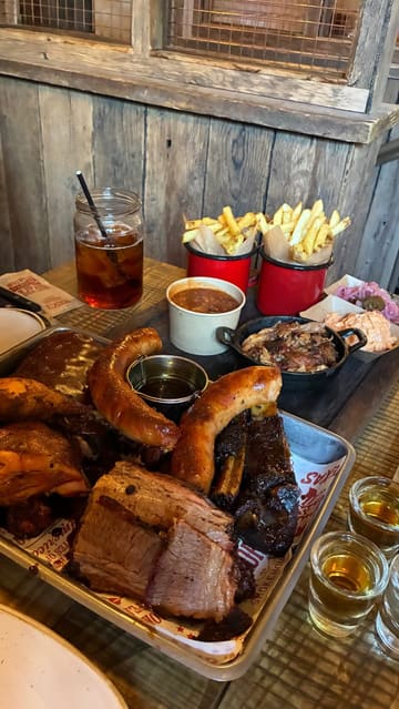 A short, energetic reel showcasing a visit to Hickory's Smokehouse. The video features the exterior, interior, drinks, and a large meat platter, providing a good overview of the dining experience.