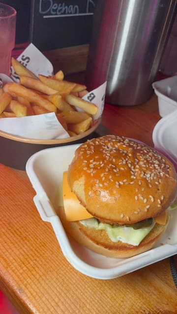 A montage of a group enjoying a bottomless brunch at a venue, featuring drinks, burgers, and a lively party atmosphere with sports screens visible.