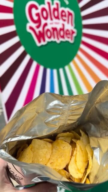 A short vlog-style video documenting a visit to a Golden Wonder pop-up event at a shopping centre, where the creator creates their own custom flavour of crisps.