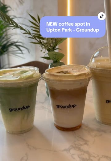 A short, aesthetic montage showcasing the drink preparation and interior of Groundup Society, a new coffee spot in Upton Park. The video highlights specific menu items like the white Spanish matcha, iced caramel latte, and mango banana smoothie, emphasizing the cafe's viral popularity and photogenic appeal.