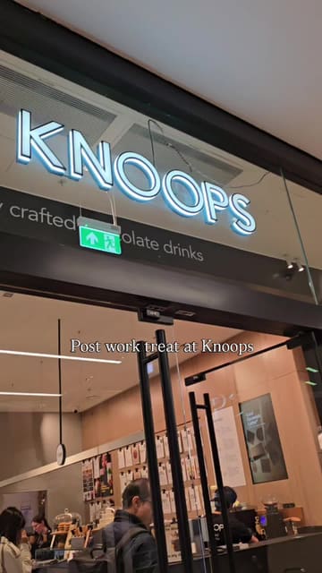 A short, functional video documenting a post-work visit to Knoops, highlighting the loyalty app, the menu selection process based on chocolate percentage, and the final mocha drink.