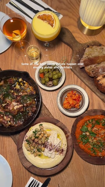 A visually appealing montage showcasing the interior, social atmosphere, and a variety of Mediterranean dishes and cocktails at Amber in London.