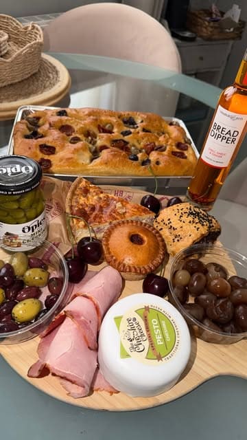 A first-person tour of Blacker Hall Farm Shop, highlighting the butchery, fresh produce, bakery, and deli counters, culminating in a selection of items for a charcuterie board.