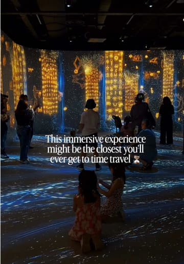 A promotional video for 'Timewalk' at ImmerseLDN, showcasing various immersive projections of ancient civilizations including Ancient Egypt, Babylon, and the Maya. The video uses a montage of clips to demonstrate the scale and visual impact of the exhibition, featuring visitors interacting with the space.