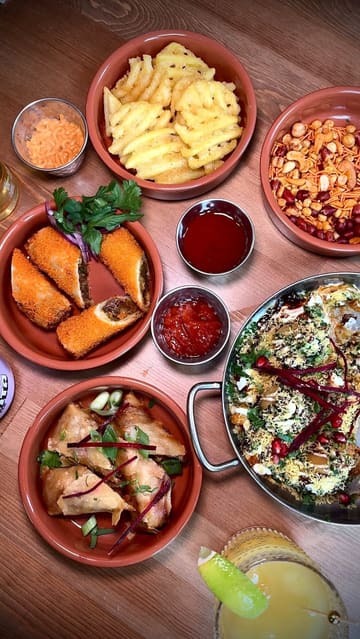 A visually appealing food showcase reel featuring a wide variety of Indian and Indo-Chinese dishes at a new restaurant in Dundee, highlighting the diverse menu and presentation.