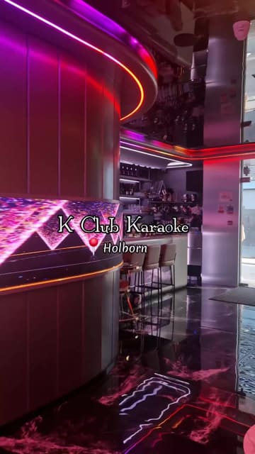 A group of friends visits K Club Karaoke in Holborn, showcasing the private karaoke rooms, mood lighting, cocktail menu, and bar snacks. The video highlights the fun atmosphere and suitability for group outings.