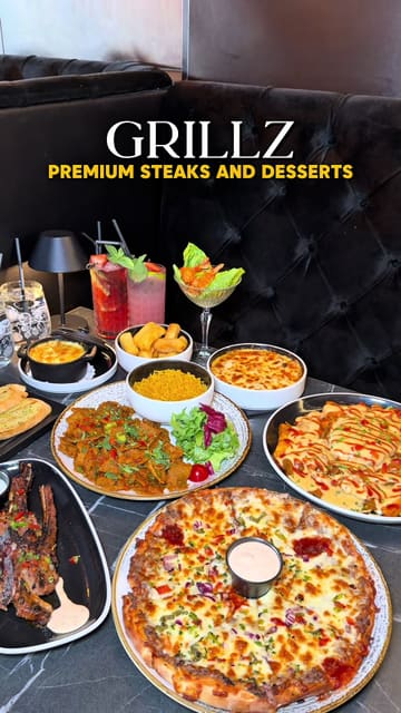 A promotional montage showcasing a wide variety of dishes including steaks, pizza, loaded fries, and desserts at Grillz, highlighting the restaurant's interior and food presentation.