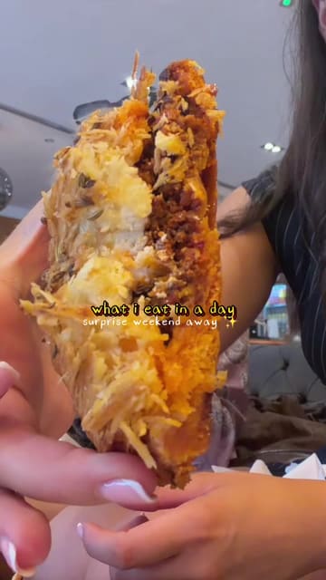 A fast-paced 'what I eat in a day' vlog documenting a birthday trip to York and Edinburgh. The creator visits Heppni Bakery for pastries, takes a train journey, visits the Johnnie Walker Princes Street experience for whisky tasting, stops at Hey Palu for cocktails and small plates, and ends the day with a sushi takeaway from Bentoya in their hotel room.