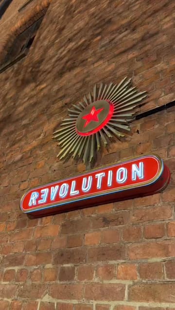 A promotional video for Revolution Bars at the Albert Dock, featuring a montage of the venue's interior, signature cocktails, and small plate food offerings, set to upbeat music.
