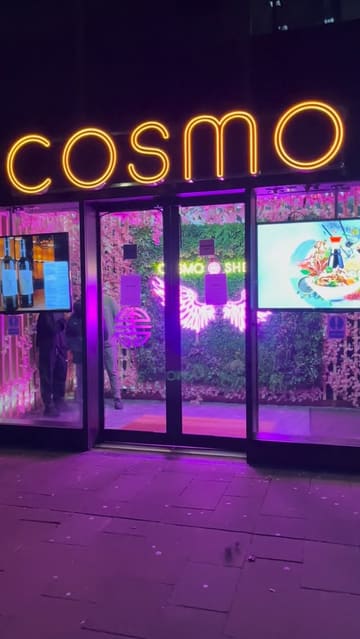 A walkthrough of a Cosmo all-you-can-eat buffet restaurant, highlighting the variety of cuisines available, the live cooking stations, and the interior atmosphere.