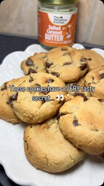 A step-by-step recipe tutorial demonstrating how to bake salted caramel chocolate chip cookies using a specific brand of butter.