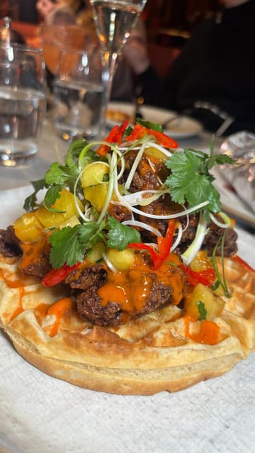 A promotional reel showcasing a special 'Waffle Week' menu at Duck & Waffle, featuring a variety of savory and sweet waffle-based dishes.
