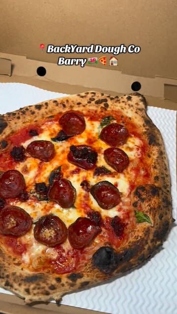 A creator visits a unique home-based pizza pop-up in a garden in Barry, showcasing the preparation process and the final pizzas.